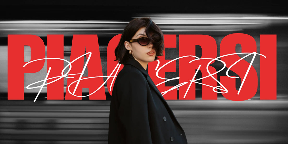 Piacersi — manifesto: donna con cappotto nero davanti a un treno in corsa e la scritta Piacersi in rosso